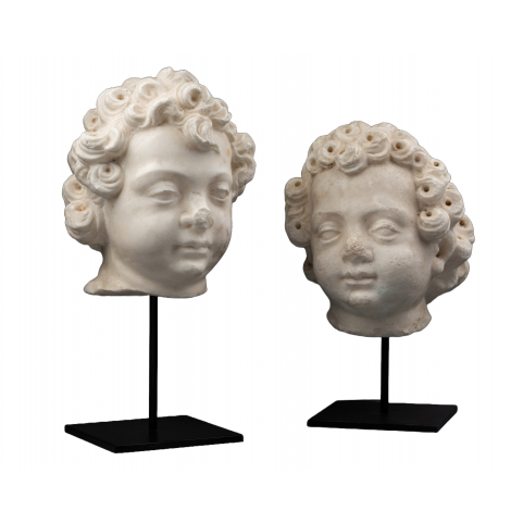 A 16th century Renaissance North Italian marble heads of two puttis